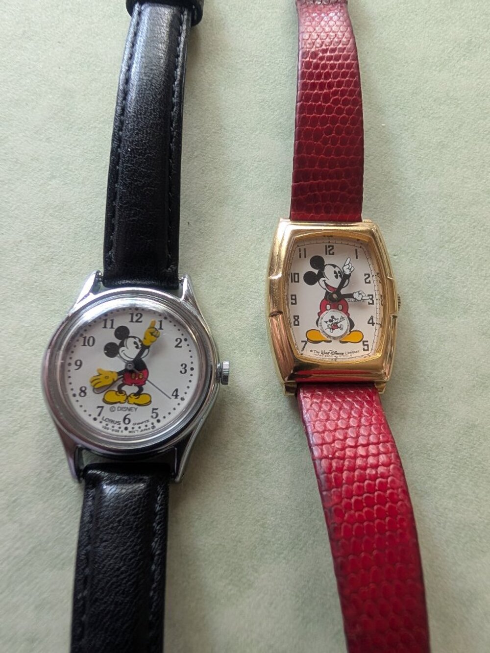 2 VINTAGE MICKEY MOUSE WATCHES, BLACK AND RED BANDS, WORK